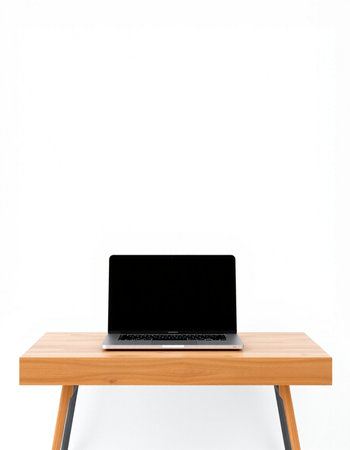 Laptop computer on wood table isolated on white background with clipping path