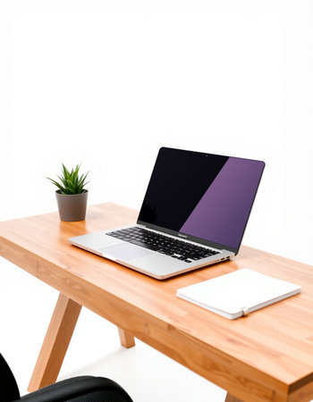 Laptop computer with blank screen on wood table isolated on white background