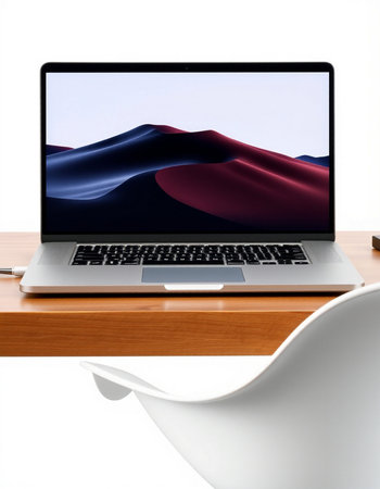 Laptop on wooden table with white chair and white wall background.