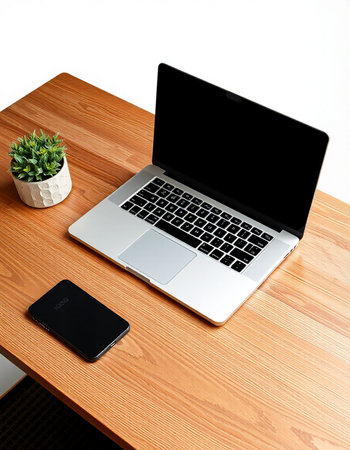Laptop and smart phone on the wooden table with white background.