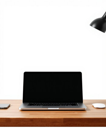 Laptop with blank screen on wooden table and lamp on white background