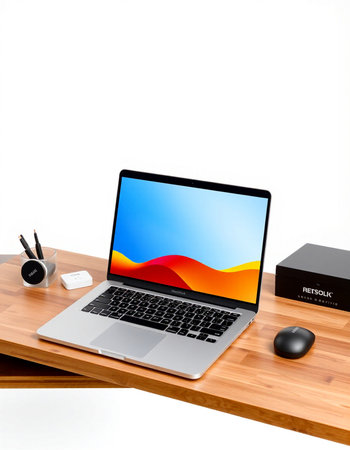 Modern workplace with laptop, mouse and stationery on wooden table isolated on white