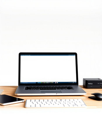 Laptop with blank screen on wood table and white wall background.