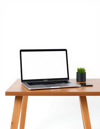 Laptop with blank screen on wooden table isolated on white background.