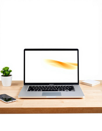Laptop with blank screen on wooden desk isolated on white background.