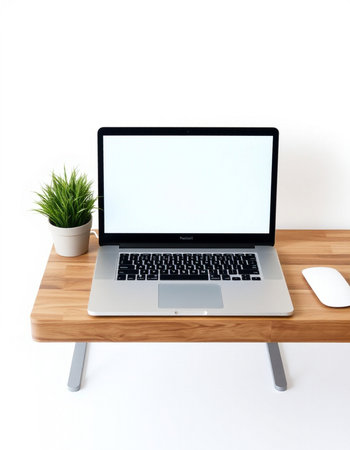 Laptop with blank screen on wooden desk isolated on white background.