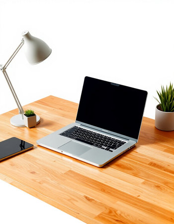 Modern workspace with laptop, smartphone and coffee cup on wooden table.