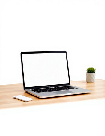 Laptop with blank screen on wooden desk isolated on white background.