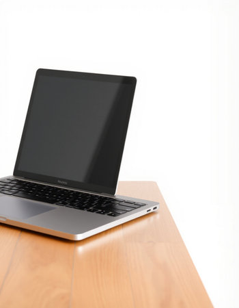 Laptop on wood table isolated on white background with clipping path.