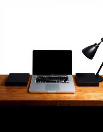 Laptop computer on wooden table and black lamp on white background.