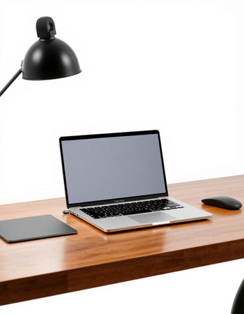 Laptop with blank screen on a wooden desk isolated on white backgroundの写真素材
