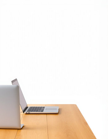 Laptop computer on wooden desk with white wall background, clipping path