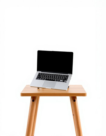 Laptop on a wooden stool on a white background. Isolated