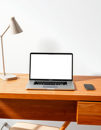 Laptop with blank screen on wooden desk. 3d rendering.の写真素材