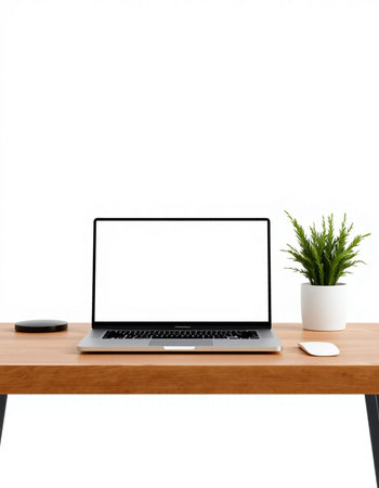 Laptop computer with blank screen on wooden desk isolated on white background
