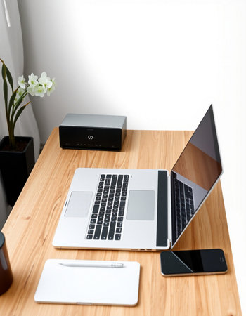 Office desk with laptop, smart phone and coffee cup on wooden table