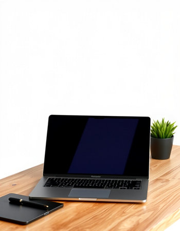 Laptop with blank screen on wood table and white wall background.