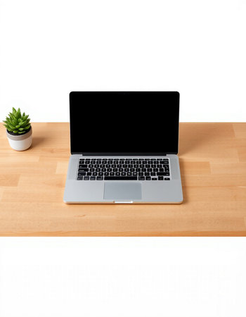 Laptop computer with blank screen on wooden desk isolated on white background