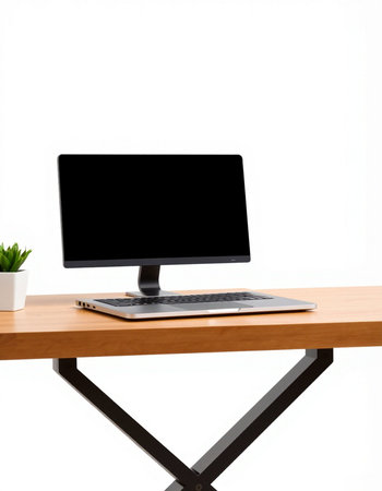 Laptop on wooden desk isolated on white background. Workplace with computer.