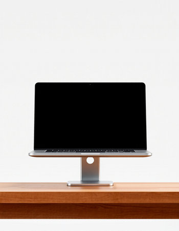 Laptop computer with blank screen on wooden desk isolated on white background