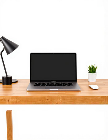 Modern workspace with blank screen laptop computer on wooden table and black lamp. 3d render