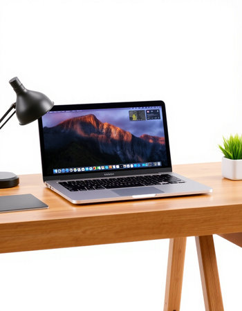 Laptop on wood table and white wall background, clipping path included