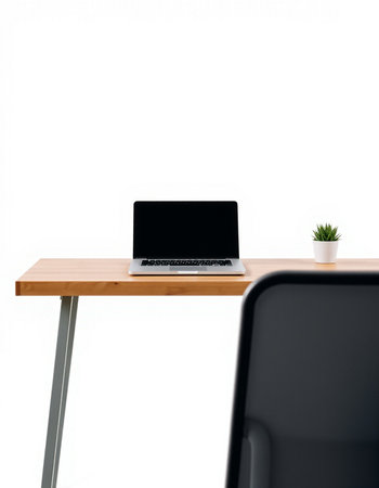 Laptop computer with blank screen on wooden desk isolated on white background