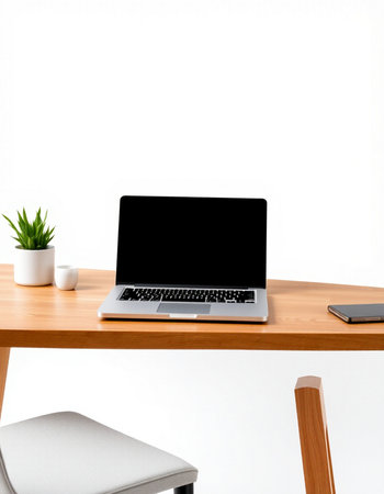 Laptop on wooden desk with white wall background, Workplace concept