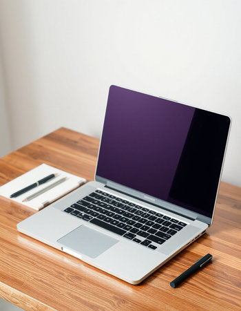 Laptop with blank screen on wooden table. Mockup for design
