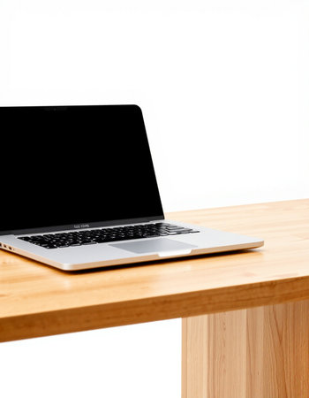 Laptop on wooden table isolated on white background with clipping path.