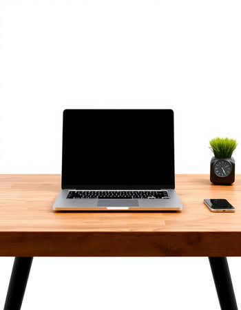 Laptop with blank screen on wooden table isolated on white background.の写真素材