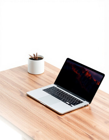 Laptop and coffee cup on wooden desk isolated on white background.の写真素材