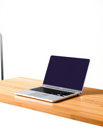 Laptop on wooden table isolated on white background with clipping path.