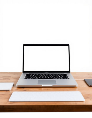 Laptop computer with blank screen on wooden table isolated on white background