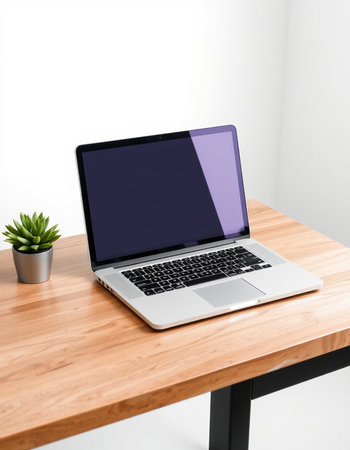 Laptop with blank screen on wooden desk in office, clipping path
