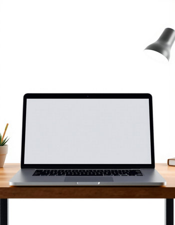 Laptop with blank screen on wooden desk isolated on white background.