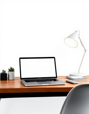 Laptop with blank screen on wooden desk and white wall background.