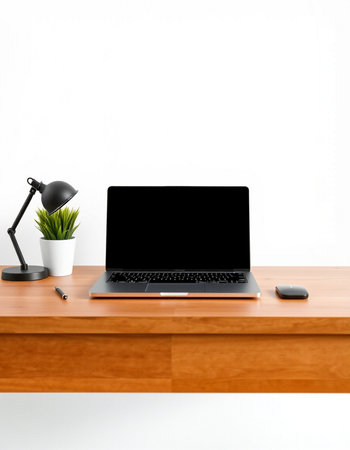 Laptop with blank screen on the wooden table and white wall backgroundの写真素材