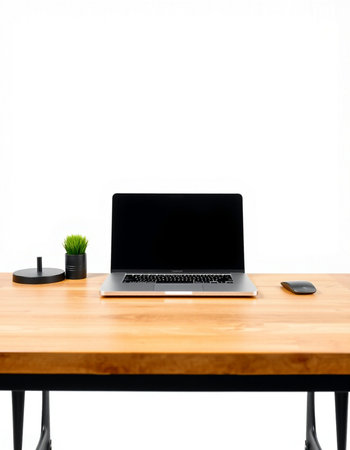 Laptop computer with black screen on wooden table isolated on white backgroundの写真素材