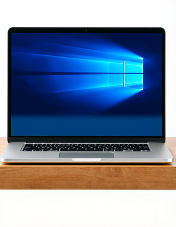 Laptop with blue screen on a wooden shelf on a white background