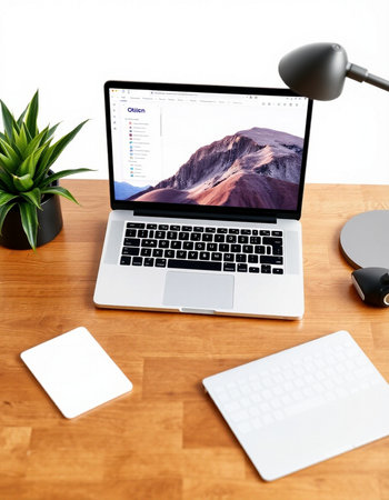 Workplace with laptop and stationery on wooden desk, closeupの写真素材