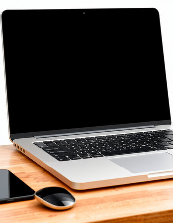 Laptop with blank screen on wooden desk isolated on white background.