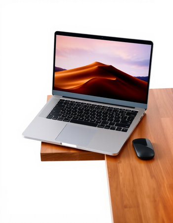 Laptop on a wooden table with a picture of a desert landscape