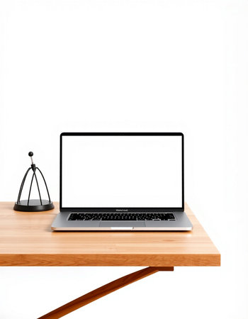 Laptop computer with blank screen on wooden table isolated on white background