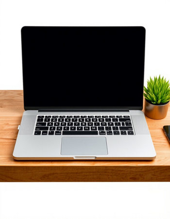 Laptop computer with blank screen on wooden desk isolated on white background
