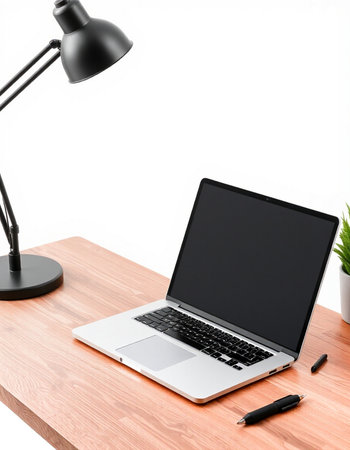 Laptop with blank screen on wooden desk isolated on white background.の写真素材