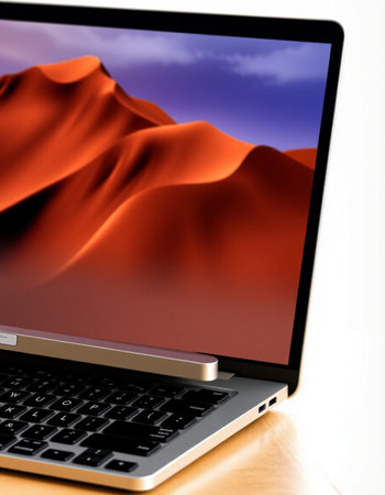 Laptop with red sand dune on screen. 3d render