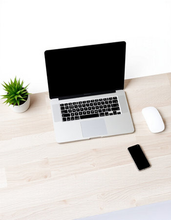 Top view of modern workspace with laptop, smartphone and decorations on wooden desk. Mock upの写真素材