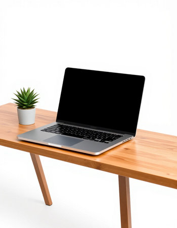 Laptop computer with blank screen on wood table isolated on white background