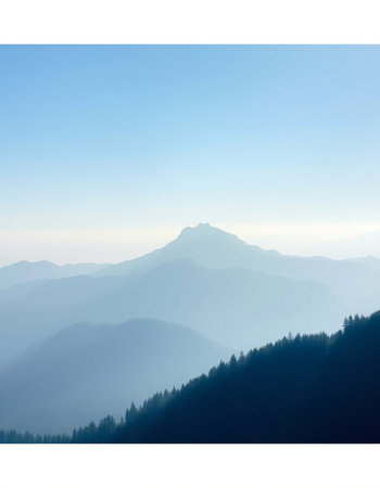 Silhouette of a mountain range in the morning mist. Nature background.